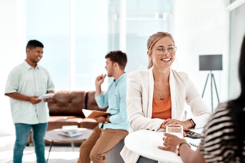 A group of colleagues socializing in the office